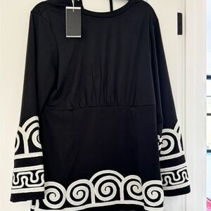 Size M dress with flared sleeves. NWT